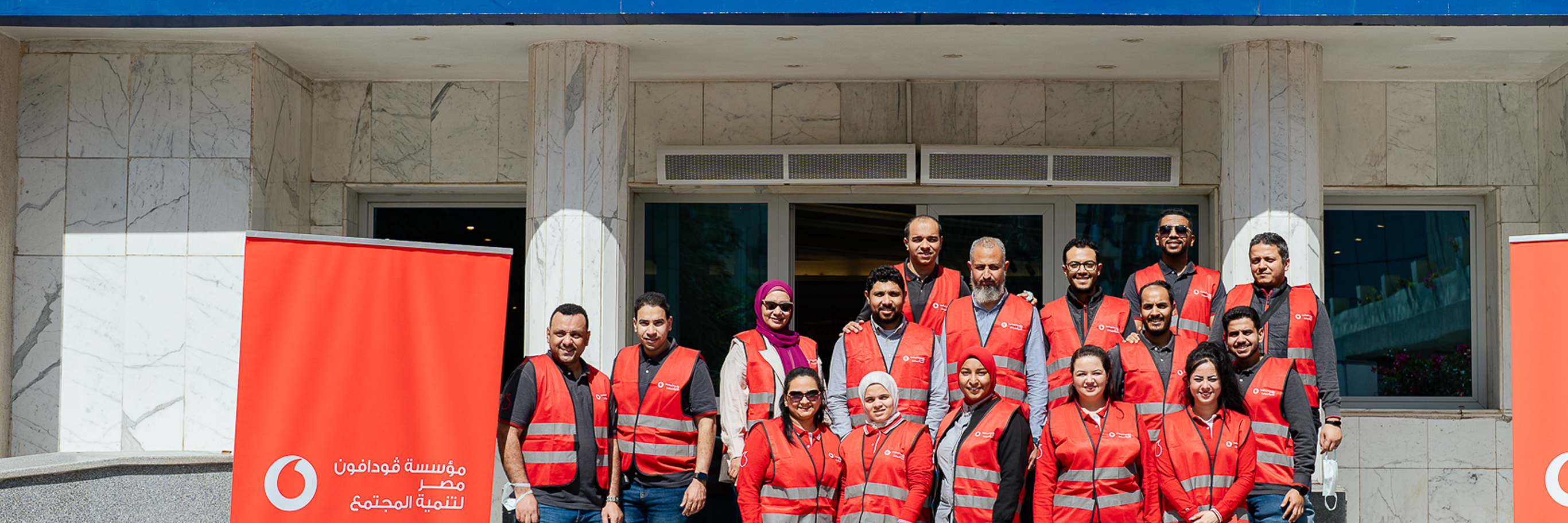 Two kids reading a book while smiling